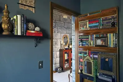 a room with a book shelf and a door with books at Waterfront 6-Bedroom Wizarding Villa in Lake Berkley Near Universal Studio's Harry Potter in Kissimmee