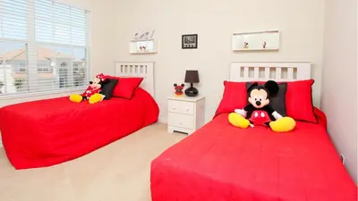 two beds with stuffed animals sitting on them in a bedroom at 6-Bedroom 2505 in Orlando