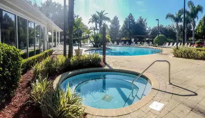 a swimming pool in the middle of a courtyard at Villa Rios Camilo - Lucaya Village in Kissimmee