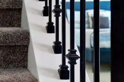 a row of black railings on a stair case at Top Rated 4BR home in Kissimmee