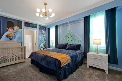 a bedroom with a blue bed and a large window at 2968 PENELOPE LOOP 10 BED in Kissimmee