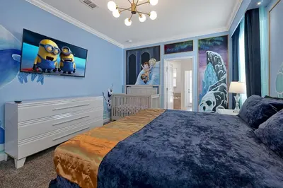 a bedroom with a large bed with blue walls at 2968 PENELOPE LOOP 10 BED in Kissimmee