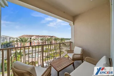 a balcony with a view of a resort at The Epic Cork Vista Cay Orlando in Orlando