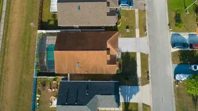 an overhead view of a house next to a street at 4820 JAMAICA LANE 4BED in Kissimmee
