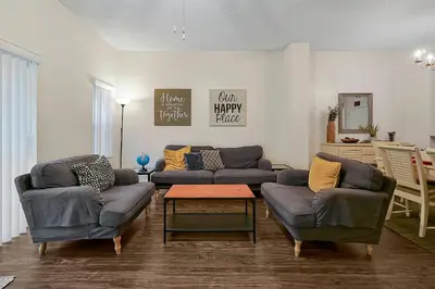 a living room with two couches and a coffee table at 8460 CRYSTAL COVE LOOP 3BED in Kissimmee