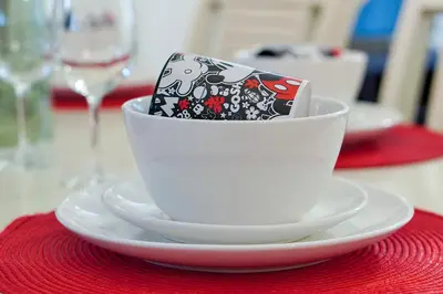 a cup on a plate with a cell phone in it at 8460 CRYSTAL COVE LOOP 3BED in Kissimmee