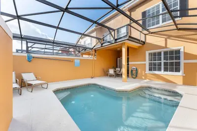 a swimming pool in the middle of a building at 4BR Retreat with Resort Access and Pool in Kissimmee