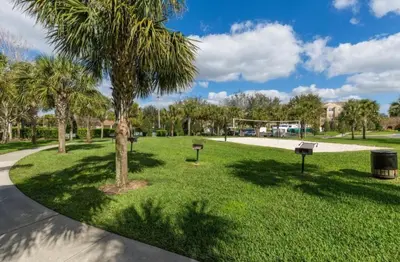 a park with palm trees and a playground at Windsor Hills Getaway: 3BR, Pool, Near Disney in Orlando