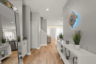 a bathroom with a football sign on the wall at 8 Bedroom 6.5 Bathroom Encore at Reunion 7644 in Orlando