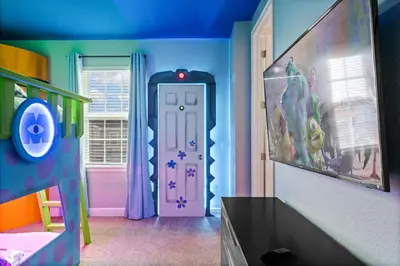 a childs room with a toy room with a mermaid door at 8 Bedroom 6.5 Bathroom Encore at Reunion 7644 in Orlando