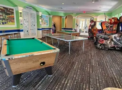 a billiard room with a pool table and a game room at Your Cozy 3 BD Home w Private Hot Tub & BBQ Gril in Kissimmee