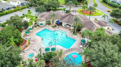 an overhead view of a pool at a resort at Your Cozy 3 BD Home w Private Hot Tub & BBQ Gril in Kissimmee