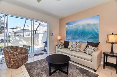 a living room with a couch and a table at Windsor Palms Escape w/ Splash Pool in Kissimmee