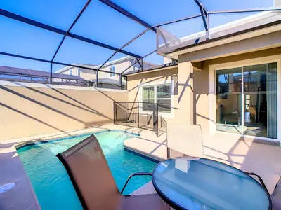 a swimming pool in a house with a glass ceiling at Lovely Themed Room with Private Pool in Kissimmee