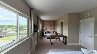 a room with a bedroom with a bed and a window at 3053 Magic Village - Jacuzzi excepcional, a 8 minutos da Disney in Orlando
