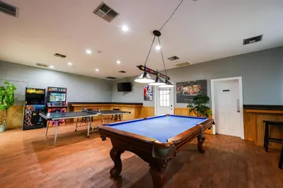 a pool table in a room with two ping pong tables at New! Family cottage near Disney-Sleep 6 in Kissimmee