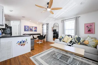 a living room with a couch and a ceiling fan at New! Family cottage near Disney-Sleep 6 in Kissimmee