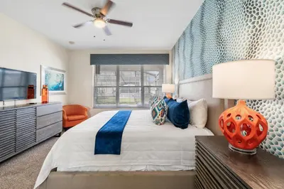 a bedroom with a bed and a ceiling fan at 7774 Basnett Circle in Kissimmee
