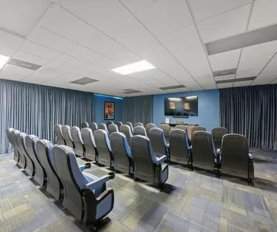 a conference room with chairs and a flat screen tv at Magic Tree Resort by Coolvacay in Orlando