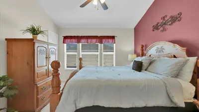a bedroom with a bed and a dresser at SPD2326 in Kissimmee