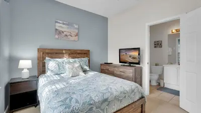 a bedroom with a bed and a television in it at SPD2326 in Kissimmee
