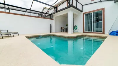 a swimming pool in a house with a roof at JLT3076 Storey Lake Resort Vacation Townhome in Kissimmee