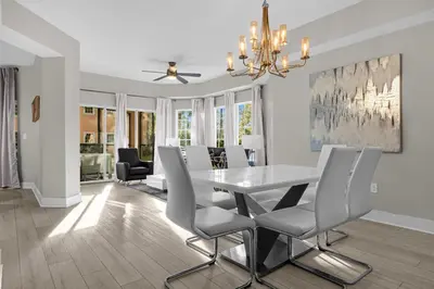 a dining room with a table and chairs at 3 Bedroom Family Friendly Condo at WorldQuest near Disney 2714 in Orlando
