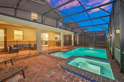 a pool in a house with a glass ceiling at Serenity Lakeview Retreat Stunning Water Views, No Rear Neighbors, Private Pool, Game Room Star Wars Cinema in Kissimmee