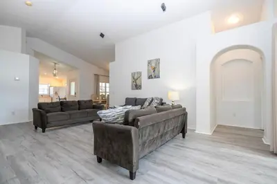 a living room with two couches and a couch at Near Disney with Pool and BBQ 4BD Single House in Kissimmee