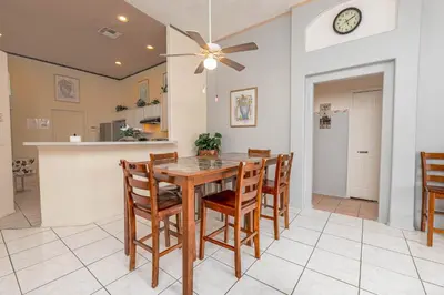 a kitchen and dining room with a table and chairs at MVP 1511ABIB LONG TERM in Kissimmee