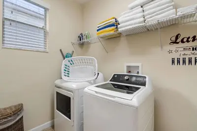 a laundry room with a washer and dryer at CUP8949 in Kissimmee
