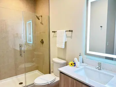 a bathroom with a shower and a toilet and a sink at TR1433SL - Island House Orlando in Orlando