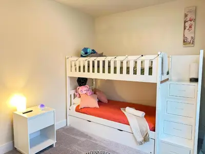 a childs bedroom with a bunk bed and a desk at TR1388PNW - Modern New Home 4 Bed in Clermont