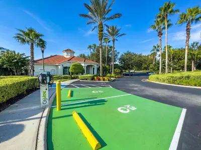 a street with a bike parking lot with palm trees at LDK2787 in Kissimmee