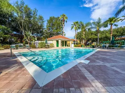 a swimming pool at a resort with palm trees at LDK2787 in Kissimmee