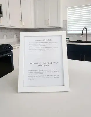 a framed picture on a counter in a kitchen at Orlando Home Vacation near Universal Studios - 3 BR in Orlando