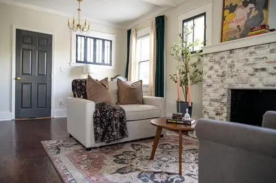 a living room with a couch and a fireplace at Historic Orlando Casita Love Apt A with backyard in Orlando