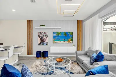 a living room with a couch and a table at Beautiful Disney House at Storey Lake in Kissimmee