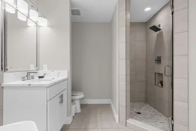 a bathroom with a shower and a sink and a toilet at 3 Bedroom Spacious Condo at WorldQuest near Disney- 22749 in Orlando