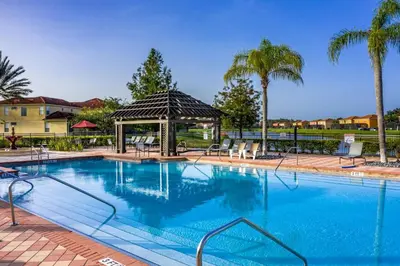 a large swimming pool with a gazebo at Gorgeous Villa with Pool and Spa in Kissimmee