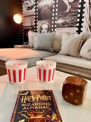a table with two cups and a book on it at Villa Paradiso at Storey Lake in Kissimmee