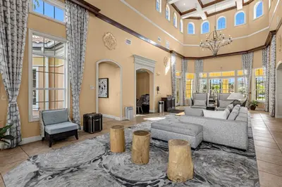 a large living room with a couch and chairs at 2 Bedroom Condo 6403 in Orlando