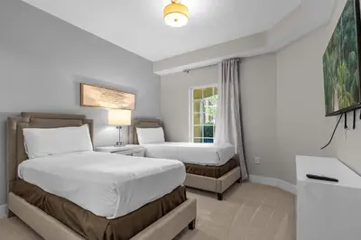 a bedroom with two beds and a window at 2 Bedroom Condo 6403 in Orlando