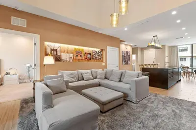 a large living room with a couch and a table at Magic Views Excelente 4 Suítes Perto da 192/Disney in Orlando