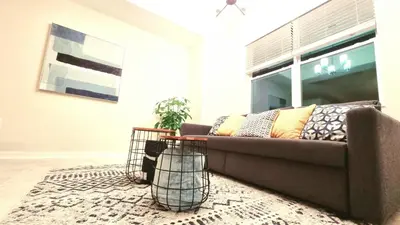 a living room with a couch and a table at Stunning Storey Lake Resort and Game room in Kissimmee