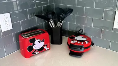 a kitchen counter with two mickeys toasters and a toaster at Stunning Storey Lake Resort and Game room in Kissimmee