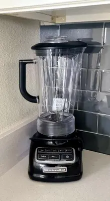 a blender sitting on top of a kitchen counter at Stunning Storey Lake Resort and Game room in Kissimmee