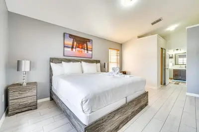 a bedroom with a large bed in a room at 8 Mi to Disney Parks Poolside Paradise! in Kissimmee