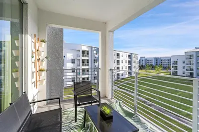 a balcony with a table and a chair on a balcony at PXC3180-303 in Kissimmee