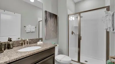 a bathroom with a sink and a shower at GAS3070 in Kissimmee
